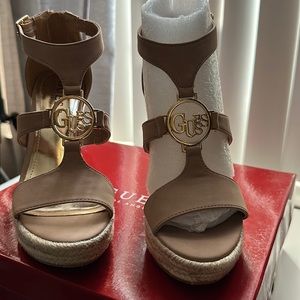 NWB GUESS tan wedges. Beautiful gold hardware, zippered in the back, SZ small.